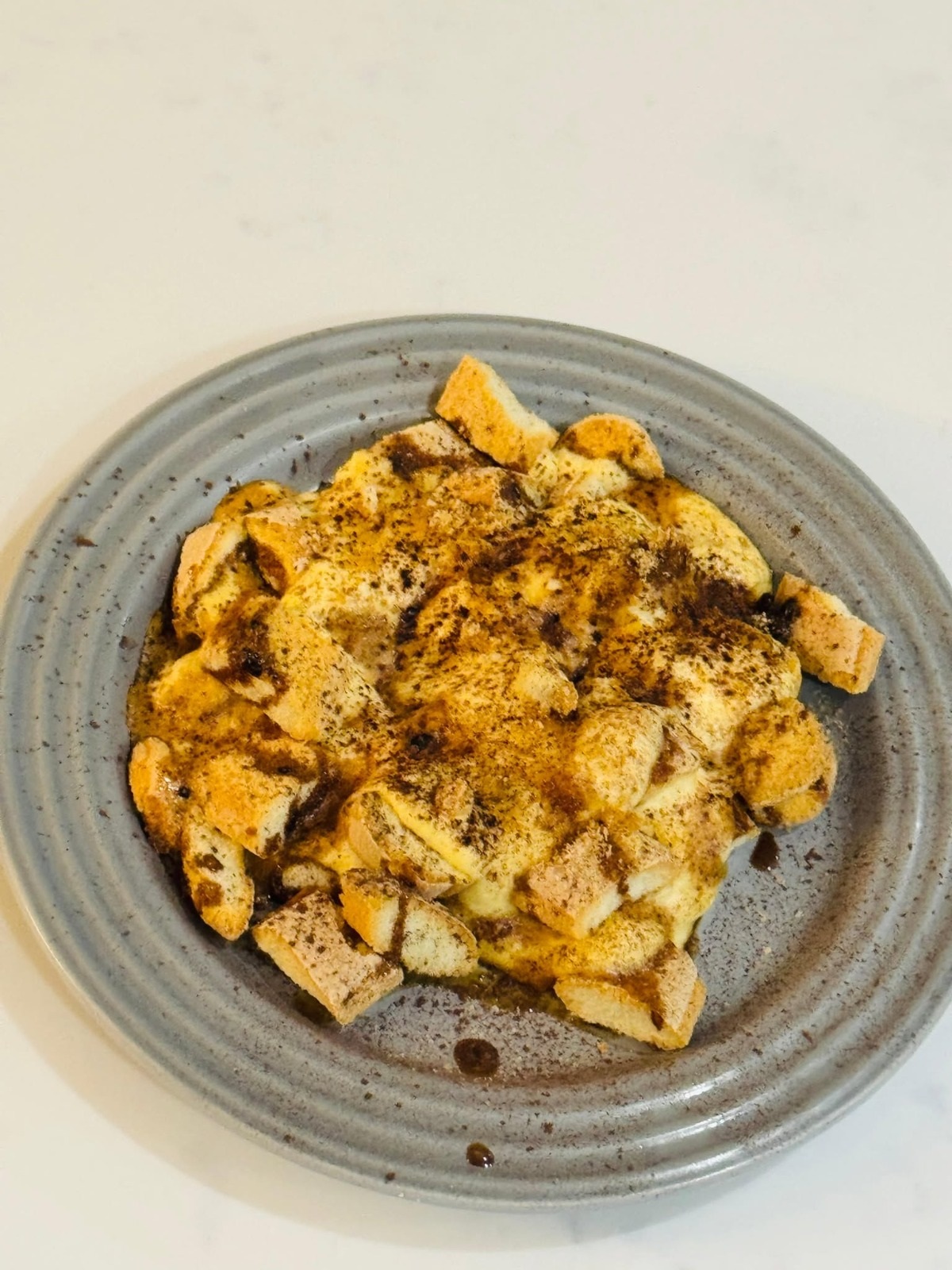 Spiced chicken plated with a rich sauce