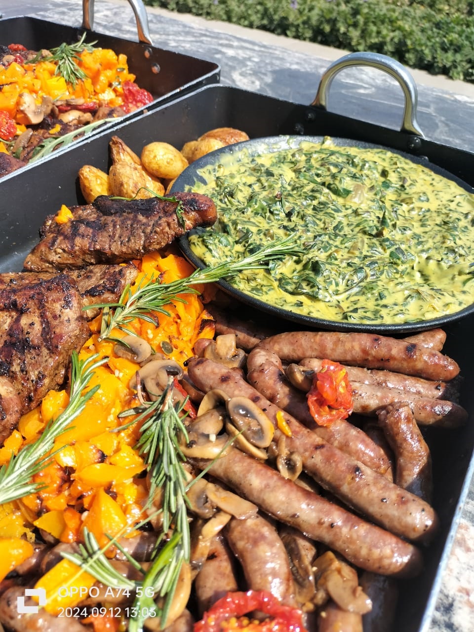 Braai buffet with grilled meats and colourful vegetables