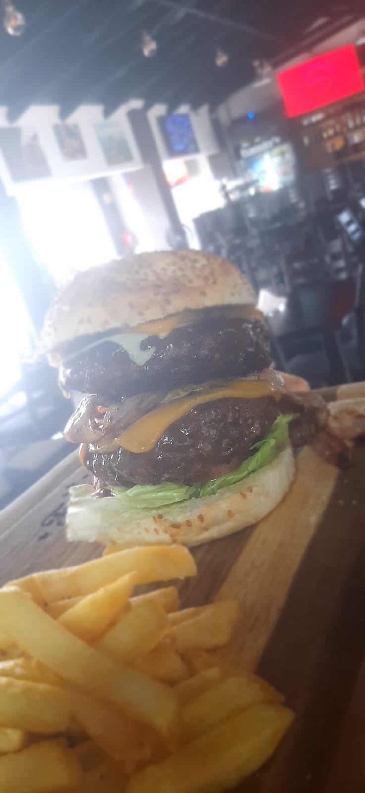 Gourmet beef burger with cheese and fresh lettuce