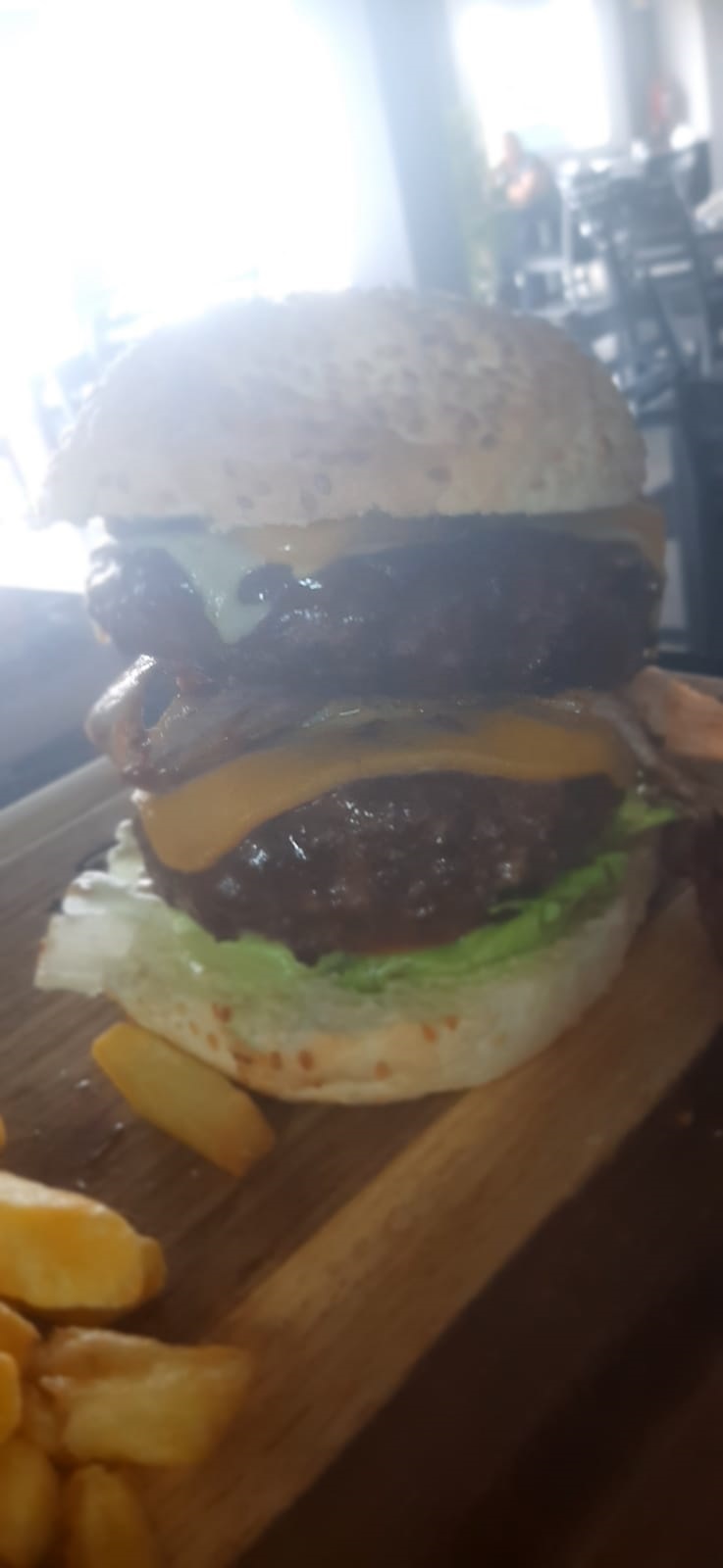 Double gourmet cheeseburger prepared for private dining